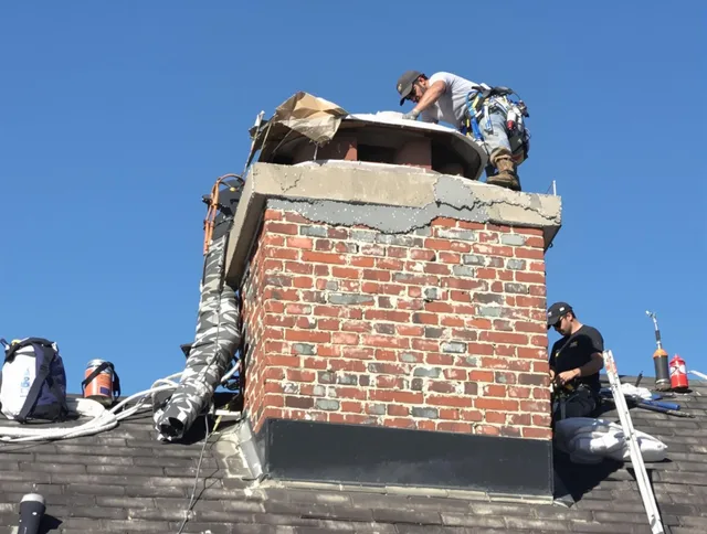 Ellington Chimney Sweep installing a custom chimney crown in Ellington, CT