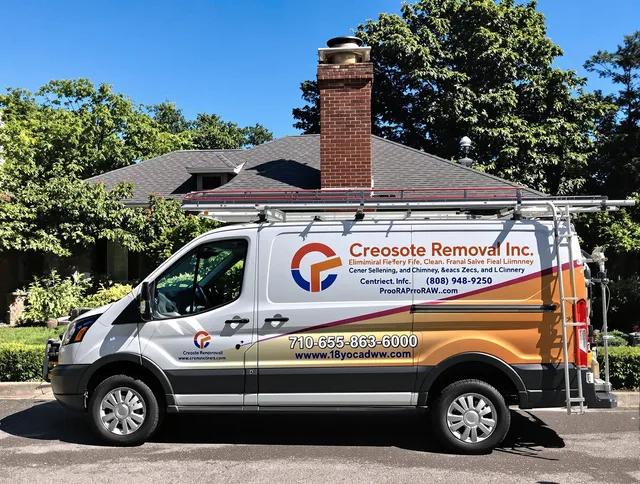 Ellington Chimney Sweep technician removing creosote safely in Ellington, CT