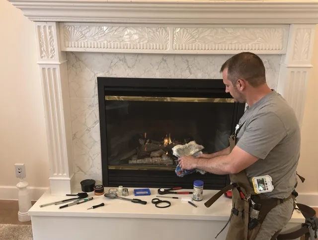Ellington Chimney Sweep performing fireplace maintenance in Ellington, CT